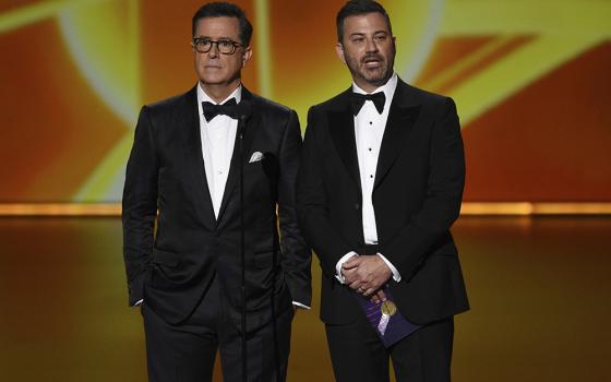 Stephen Colbert, left, and Jimmy Kimmel present the award for outstanding lead actress in a comedy series at the 71st Primetime Emmy Awards on Sunday, Sept. 22, 2019, at the Microsoft Theater in Los Angeles. (AP/InvisionChris Pizzello)