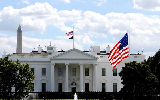 Flags at the White House in Washington fly at half staff following a deadly shooting incident in the church at Annunciation Catholic School in Minneapolis. A shooter opened fire with a rifle through the windows of the school's church and struck children celebrating Mass Aug. 27 during the first week of school, killing two and wounding 21 people in an act of violence the police chief called "absolutely incomprehensible." (OSV News/Reuters/Brian Snyder)