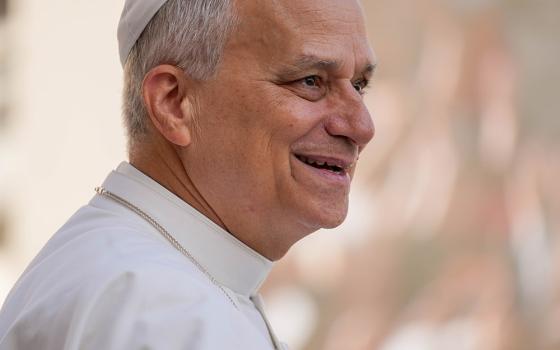 Pope Leo XIV smiles as he greets visitors and pilgrims from the popemobile as he rides around St. Peter's Square at the Vatican before his weekly general audience Sept. 17, 2025. (CNS/Lola Gomez)