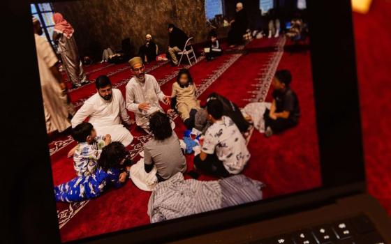 Ayman Soliman, center, talks to children at a Cincinnati mosque. Soliman is in ICE detention and facing deportation to Egypt. (Faces blurred by ProPublica) (ProPublica/Maddie McGarvey) 