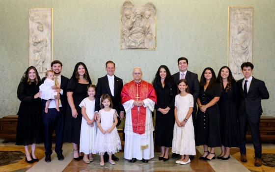 Pope Leo XIV poses for a photo with Brian Burch, the new U.S. ambassador to the Holy See, the ambassador's wife, Sara, and their nine children, daughter-in-law and granddaughter in the Apostolic Palace at the Vatican Sept. 13. (CNS/Vatican Media)