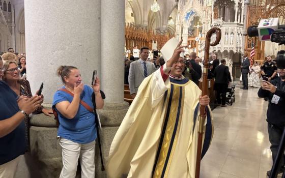  Auxiliary Bishop Bismarck Chau of Newark blesses the assembly at Cathedral Basilica of the Sacred Heart after he was consecrated as bishop during a Mass Sept. 8. Chau came to the U.S. as an undocumented immigrant from Nicaragua in 1984. (NCR photo/Camillo Barone)