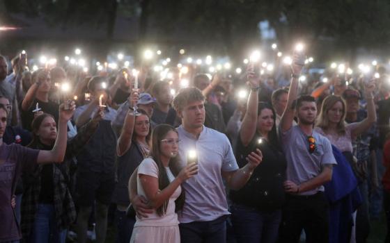Young people use their cellphone lights during a vigil at Orem City Center Park in Utah Sept. 11  after U.S. conservative activist and commentator Charlie Kirk, 31, was fatally shot during a Sept. 10 event at Utah Valley University in Orem. (OSV News/Reuters/Jim Urquhart)