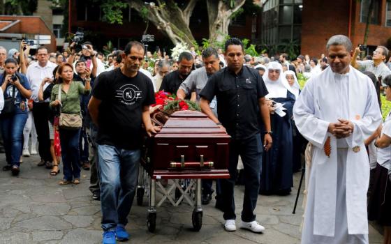 Pallbearers walk with the casket of Jesuit Fr. José María Tojeira during his funeral procession at the Central American University in Antiguo Cuscatlan, El Salvador, Sept. 11. The beloved human rights activist, best known for leading the Central American Jesuits during El Salvador's civil-war era, died Sept. 5 at age 78 in Guatemala City, Guatemala. (OSV News/Jose Cabezas)