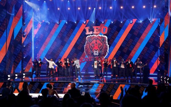 Music artist Aloe Blacc and the Leo High School Choir sing on stage during the 20th season finale of the talent competition series "America's Got Talent" Sept. 24. (OSV News/Trae Patton, NBC)