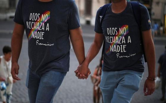  Members of the LGBTQ+ community, with T-shirts reading "God does not reject anyone" in Spanish, arrive to attend a vigil prayer in the Church of the Gesu in central Rome Sept. 5. (AP/Andrew Medichini)