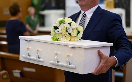 An infant's funeral takes place at St. Anthony Shrine in Boston. (Julianne Gauron)
