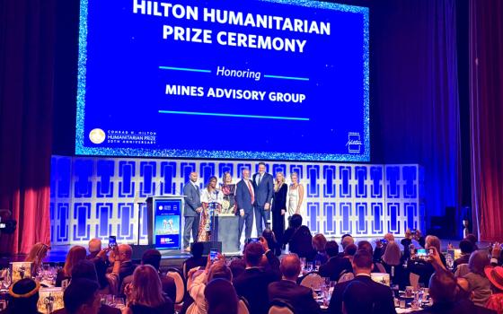The Mines Advisory Group representatives receive the 2025 Hilton Humanitarian Prize in New York, Oct. 6. (NCR photo/Camillo Barone)