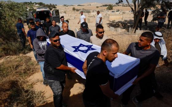 Pallbearers carry the coffin of Sgt. Major Muhammad al-Atarash during his funeral Oct. 16, 2025, in Sawe in southern Israel. According to the Israeli army, al-Atarash fell in combat during the Oct. 7, 2023, attack by Hamas on Israel. His body was taken by Hamas to Gaza and returned to Israel as part of a ceasefire and hostage-prisoner swap deal between Israel and Hamas. (OSV News/Reuters/Ammar Awad)