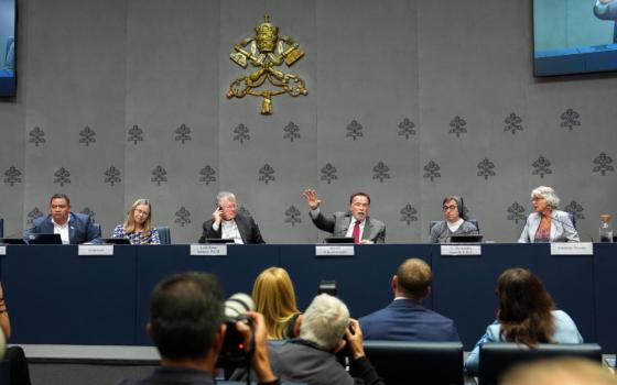Arnold Schwarzenegger, actor and former California governor, gestures during a Vatican news conference on “Raising Hope for Climate Justice” Sept. 30, 2025. He is joined on the panel by Brazilian Cardinal Jaime Spengler of Porto Alegre, Salesian Sister Alessandra Smerilli, secretary of the Dicastery for Promoting Integral Human Development, and others. (CNS/Lola Gomez)