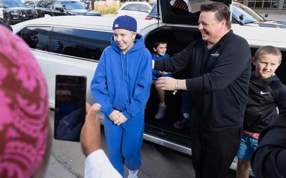 Sophia Forchas, an Annunciation Church and School mass shooting victim, and her father, Tom Forchas, right, arrive at the Hennepin County Medical Center on Oct. 23, 2025, in Minneapolis. (The Catholic Spirit/Archdiocese of St. Paul and Minneapolis via AP)