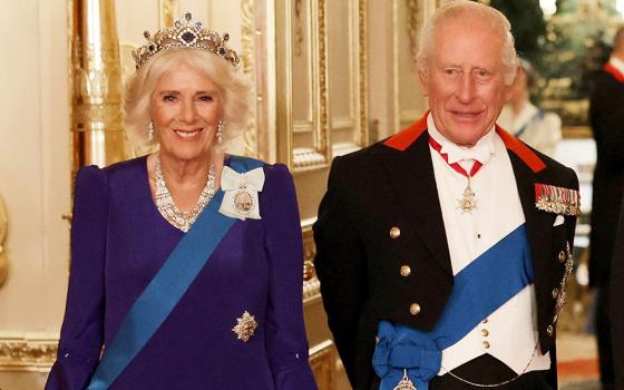 Britain's Queen Camilla, left, and King Charles III, right, pose for a photo before a State Banquet at Windsor Castle, in Windsor, England, Sept. 17, 2025. (Phil Noble/Pool Photo via AP, file)