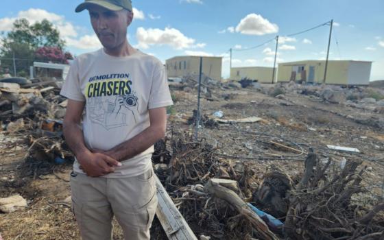 Eid Hathaleen is a cousin of Awdah Hathaleen, an Umm al-Khair resident and peace activist shot and killed by an Israeli settler in July. His T-shirt signifies continued resistance by Umm al-Khair residents to planned house demolitions announced by the Israeli government. (NCR photo/Chris Herlinger)