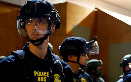 Federal law enforcement officers confront protesters outside Oregon's Immigration and Customs Enforcement (ICE) facility in Portland, Oregon, Oct. 3, 2025. (OSV News/Reuters/John Rudoff)