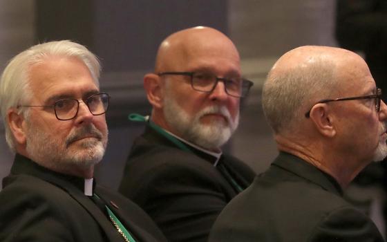 Archbishop Paul Coakley of Oklahoma City, left, looks on moments after being elected president of the U.S. Conference of Catholic Bishops during a Nov. 11, 2025, session of the fall general assembly of the U.S. bishops' in Baltimore. His three-year term begins at the close of the Nov. 11-13 plenary. (OSV News/Bob Roller)