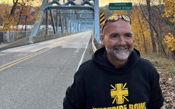 Fr. Gary Graf walks in Pennsylvania on Nov. 3 during his two-month, 900-mile pilgrimage to draw attention to the trauma deportations are causing immigrant families. The Chicago priest began the walk Oct. 6 at Pope Leo XIV's boyhood home in suburban Chicago and concluded on Dec. 2 in New York Harbor. (Courtesy of Lauren Foley)