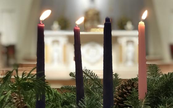An illustration shows three of the candles lit on the Advent wreath at St. Agnes Church in Arlington, Virginia, Nov. 21, 2023. (OSV News file photo/Arlington Catholic Herald/Ann M. Augherton)