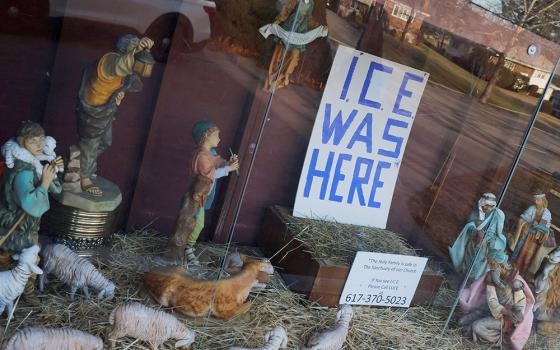 A sign reading "ICE Was Here" stands in the outdoor Nativity at St. Susanna Catholic Church in Dedham, Massachusetts, Dec. 8, 2025. (OSV News/Reuters/Brian Snyder)