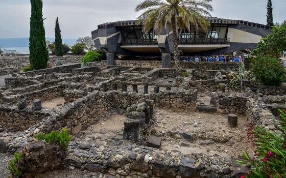 Remains of ancient residential buildings are seen next to St. Peter's Church at the archaeological site of Capernaum in northern Israel. The church is built over the site believed to be the house of St. Peter. (Wikimedia Commons/Bahnfrend)