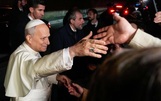 Pope Leo XIV greets people as he leaves the Castel Gandolfo residence in Italy to head to the Vatican Dec. 27, 2025. (AP/Gregorio Borgia)