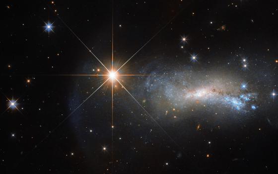 A star named TYC 3203-450-1 outshines a more distant galaxy, NGC 7250, in this Hubble Space Telescope image. (ESA/Hubble & NASA)