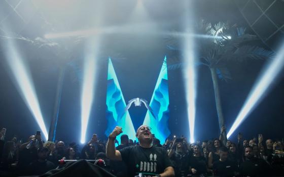 Portuguese Fr. Guilherme Peixoto, a DJ, performs during a concert in Beirut, Lebanon, Jan. 11 after a Lebanese court rejected a request by a group of Christian religious figures who filed a petition seeking a ban to the concert saying it violates the church's teachings. (AP/Hussein Malla)