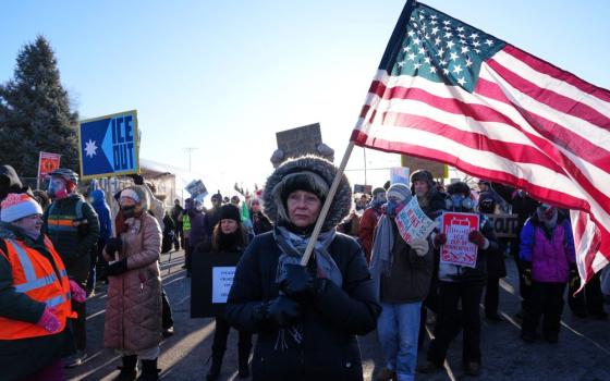 People gather for a protest against ICE outside the Bishop Henry Whipple Federal Building Jan. 30 in Minneapolis. (AP/Adam Gray)