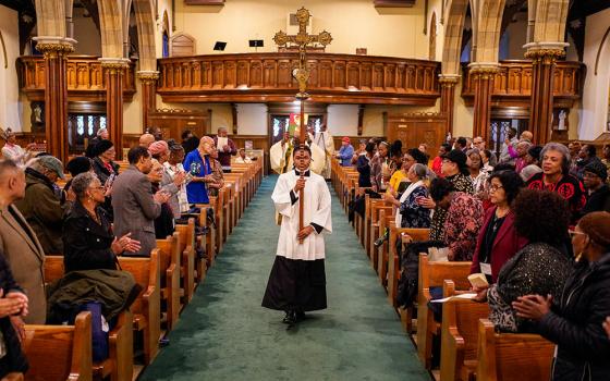An altar server leads the opening procession during Mass at the inaugural New York Black Catholic Congress at Blessed Sacrament Church in New Rochelle, N.Y., Nov. 22, 2025. (OSV News/Gregory A. Shemitz)