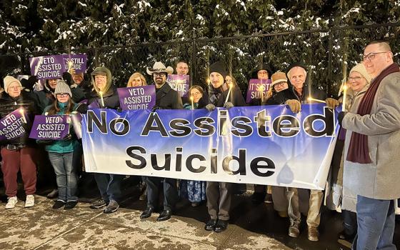 Opponents of New York state's proposed assisted suicide bill stand outside the governor's mansion in Albany, Dec. 3, 2025, for a candlelight vigil urging Gov. Kathy Hochul to veto the bill passed by the Legislature June 9. Hochul announced Dec. 17 that she would sign an amended bill in January. (OSV News/The Evangelist/Emily Benson)
