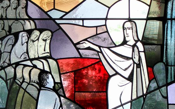 A stained glass window depicts Jesus giving the Sermon on the Mount, which begins with the beatitudes. (Wikimedia Commons/Lothar Spurzem)