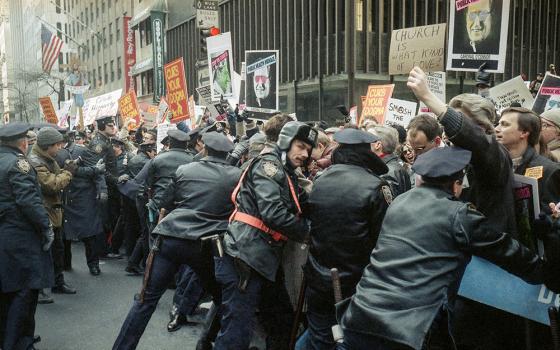 Police keep AIDS activists and pro-choice groups demonstrating outside of St. Patrick's Cathedral behind barriers, Dec. 10, 1989, in New York City. (AP/Frankie Ziths)