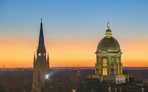 The sun sets over the main building and Basilica of the Sacred Heart steeple on the campus of the University of Notre Dame in South Bend, Ind., Nov. 23, 2025. (OSV News/University of Notre Dame/Matt Cashore)