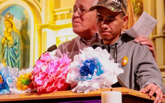 Ruben Garcia of Annunciation House introduces Wilson Alexander Juarez Hernandez at an event at Sacred Heart Church in El Paso, Texas, March 21, 2024. Hernandez was a survivor of the fire that killed 40 people and injured about two dozen more in a migration detention center in Ciudad Juarez, Mexico, in 2023. (OSV News/Courtesy of Hope Border Institute/Diego Adame)