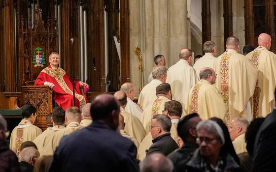 Archbishop Ronald Hicks looks on as priests enter the sanctuary to receive Communion during his installation Mass as the new archbishop of New York at St. Patrick's Cathedral in New York City Feb. 6, 2026. (OSV News/Gregory A. Shemitz)