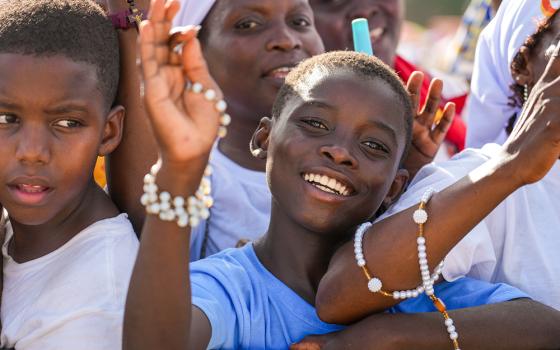 Children and others smile as they attend a prayer service with Pope Leo XIV at the Sanctuary of Our Lady of Muxima in Muxima, Angola, April 19, 2026. (CNS/Lola Gomez)