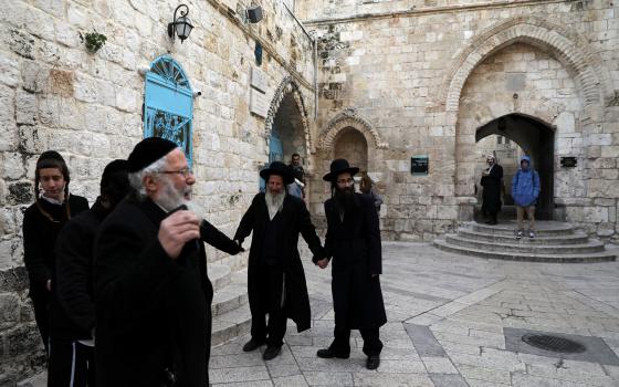 Ultra-Orthodox Jews pray outside the Cenacle in Mount Zion near Jerusalem's Old City, a hall revered by Christians as the site of Jesus' Last Supper. 