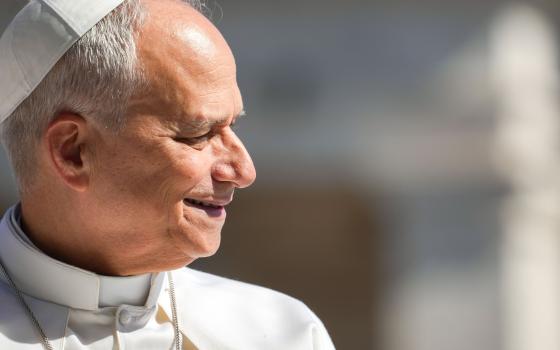 Pope Leo XIV smiles as he greets visitors and pilgrims from the popemobile while riding around St. Peter’s Square at the Vatican before his weekly general audience May 20, 2026. (CNS photo/Lola Gomez)