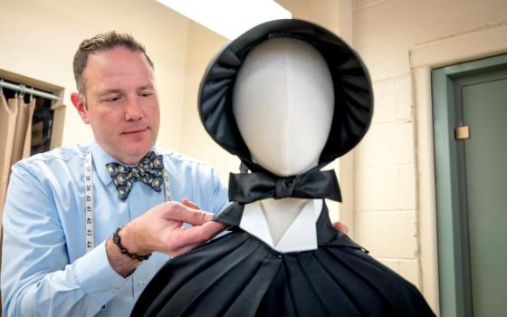 Darrin Pufall Purdy, theater professor at Boise State University, fixes a replica of a habit the Sisters of Charity of New York wore in the 1950s in an undated photo. Pufall Purdy's research on the habits of women religious led him to advise and design costumes for Broadway. (Courtesy of Darrin Pufall Purdy/Priscilla Grover) 