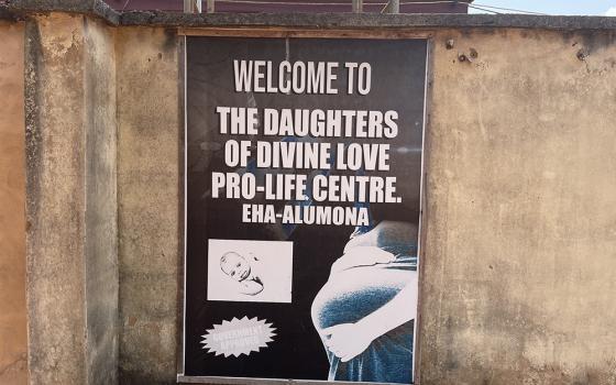 A sign outside for the Daughters of Divine Love Pro-Life Centre is mounted on the facility’s perimeter wall in Eha-Alumona, Nigeria. (John Chukwu)