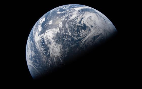 Earth is illuminated against the blackness of space in this photo taken by an Artemis II crew member through an Orion spacecraft window on April 2, 2026, the second day of the mission. (NASA)