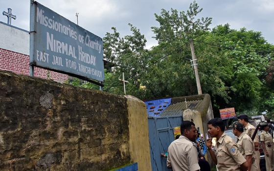 Indian police stand outside the premises of the Missionaries of Charity home in Ranchi, where Sr. Concelia Baxla, 62, was arrested July 5, 2018, on suspicion of child trafficking. (CNS/Reuters)