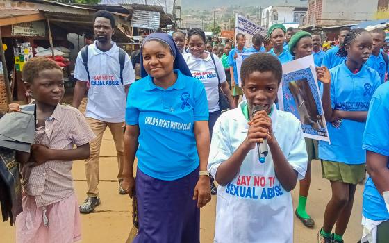 Child Rights Watch Club members and community participants join a campaign march Oct. 29, 2025, in Grafton Community, Freetown, Sierra Leone, to raise awareness on teenage pregnancy, early marriage, gender-based violence and drug abuse. (Courtesy of Misean Cara Ireland/NLW Germany)