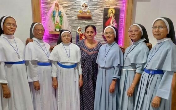 The Kallidukkil sisters pose with their youngest sister, Pauline Kallidukkil, at her residence in Valillapuzha, Kerala, southwestern India. Pauline Kallidukkil is at center. On her right are Srs. Gracious Kallidukkil, Ancy Kallidukkil and Philo Kallidukkil; on her left are Srs. Jacintha Kallidukkil, Mareena Kallidukkil and Rosetom Kallidukkil. (Courtesy of Philo Kallidukkil)