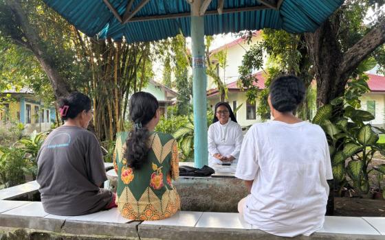 Holy Spirit Sr. Frederika Tanggu Hana speaks with female survivors of violence at St. Theresa Shelter in Labuan Bajo, eastern Indonesia. Accompaniment and trauma-informed care are central to daily ministry at the shelter, founded in 2018. (Ryan Dagur)