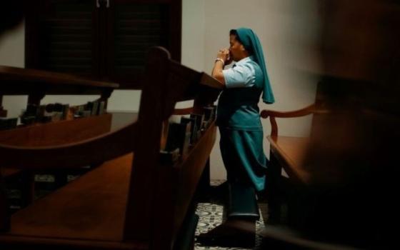 Sister prays.