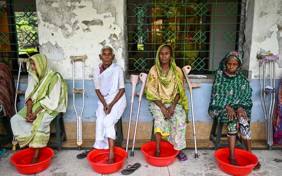 Patients soak their foot ulcers before receiving new dressings at the Dhanjuri Leprosy Center in Dinajpur, Bangladesh. Proper hygiene is a critical component of preventing secondary infections in leprosy cases. (Piyas Biswas)