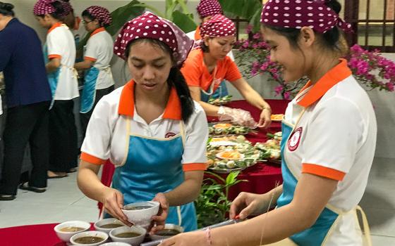 Housemaids prepare food during the 20th anniversary celebration of the Daughters of Charity of St. Vincent de Paul sisters' housemaid training program on May 10, 2026, in Ho Chi Minh City, Vietnam. (Joachim Pham)