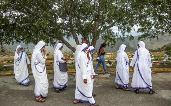 Members of the Missionaries of Charity walk after accompanying a burial for earthquake victims at La Esperanza Cemetery in La Guaira, Venezuela, July 6, 2026. Two catastrophic earthquakes hit Venezuela in quick succession June 24, leaving at least 3,500 dead, which experts say is a major undercount. (OSV News/Reuters/Adriano Machado)