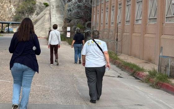 Catholic Sisters Walking with Migrants participants walk alongside the U.S. wall at the Morley Port of Entry in Nogales, Arizona. (Eileen McKenzie)