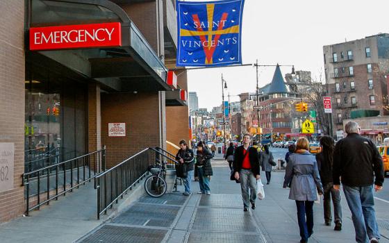 Pedestrians walk past the emergency entrance at St. Vincent's Hospital in New York, March 16, 2010. The 160-year-old hospital closed the following month. (AP/Kathy Willens)